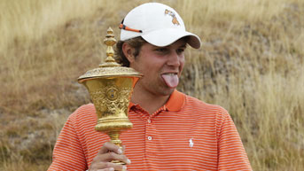 Oklahoma State Golfer Peter Uihlein Sticks His Tongue Out at a Member of the Gallery while Accepting the U.S. Amateur Championship Trophy. (AP Photo)